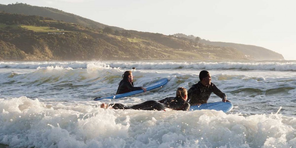 Surfing on Raglan Beach, Waikato